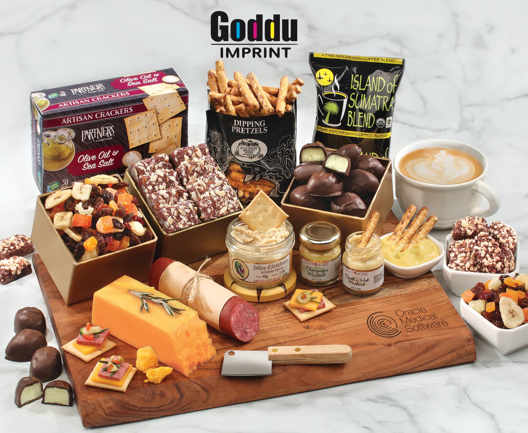 Branded executive gift: engraved wood charcuterie board with assembled gourmet snacks and chocolates.